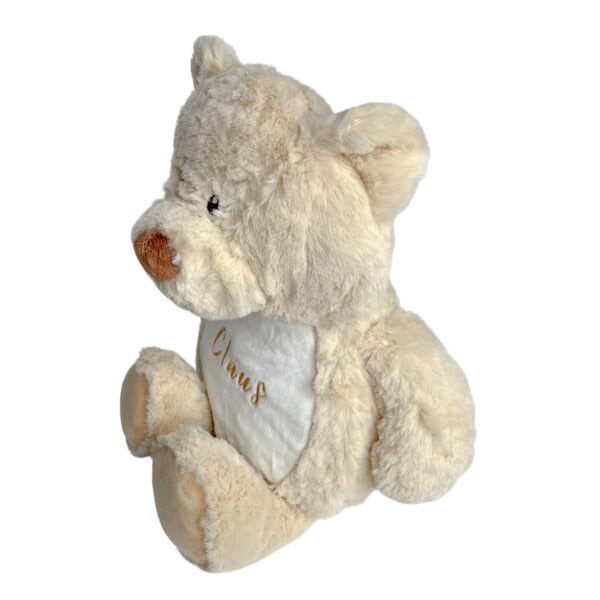 Personalisiertes Kuscheltier Teddy mit Blick auf die linke Seite