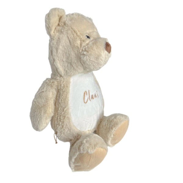 Personalisiertes Kuscheltier Teddy mit Blick auf die rechte Seite